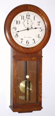 Seth Thomas, Thomaston, Conn. (Div Gen'l Time Instruments Corp) "REGULATOR NO. 2" model, 8 day time only No. 77 B brass mvt in oak case with 12" dial, weight driven. C. 1930. — Antique Clocks Price Guide