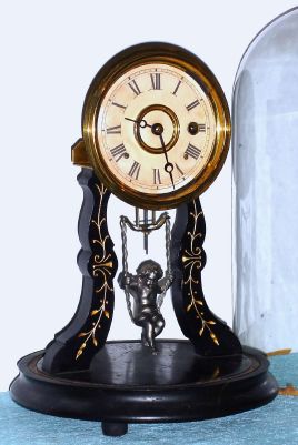F. Kroeber Clock Co., New York, "ANGEL SWING No. 4", 8-day timepiece with winged cherub pendulum that swings front to back. C.1882. — Antique Clocks Price Guide