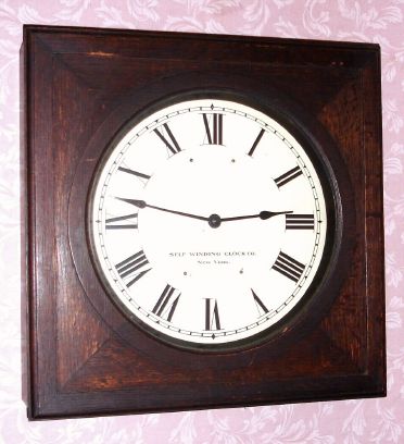Self Winding Clock Co, New York, time mvt Style No. 29 Serial No. 14034 in oak case with 14" dial, original paper instructional labels and metallic identification tags all present, electrically driven and designed for use under lease by Western Union to receive a synchronizing signal from the Naval Observatory in Washington D.C. C. 1930. — Antique Clocks Price Guide