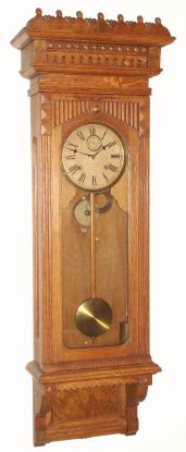 Wm. L. Gilbert Clock Co., Winsted, Conn, "REGULATOR No. 11", in an oak case with burled accent. C.1891. — Antique Clocks Price Guide