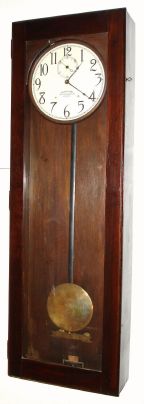 International Time Recording Co., Endicott, New York, master clock model No. 17-7 in a dark mahogany stained case, self winding. C.1918. — Antique Clocks Price Guide