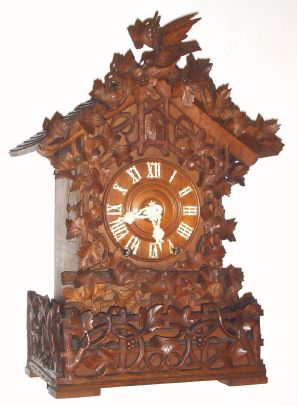 German, J. B. Beha, Eisenbach, MODEL 512 shelf cuckoo in walnut, with wooden plated 8-day double fusee movement. C.1880. — Antique Clocks Price Guide