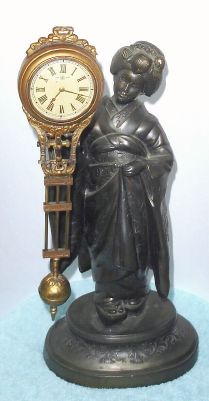 Japanese, Swinging Arm Clock, GEISHA GIRL, with 3-day timepiece movement. C.1925. — Antique Clocks Price Guide