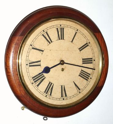 English, W. Elliott, Dial or pub clock, single fusee, time only in a mahogany case, serial No. 17868. C.1900. — Antique Clocks Price Guide