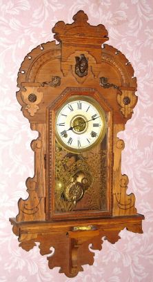 Seth Thomas Clock Co., KING BEE, oak cased hanging gingerbread clock, time, strike and alarm, 8-day. Manufactured by Seth Thomas for the L. B. Price Co of Kansas City. C.1912. — Antique Clocks Price Guide