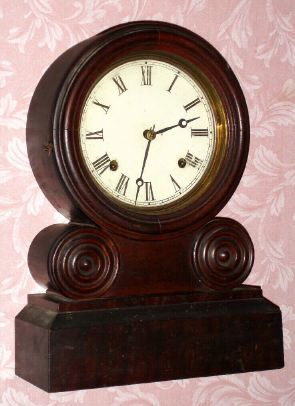 E. Ingraham and Co., "GRECIAN" round top shelf clock, 8-day time and strike, spring. C.1869. — Antique Clocks Price Guide