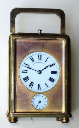 French, TEC and Charles Hour for J. E. Caldwell, Philadelphia, GRAND SONNERIE brass cased carriage clock in an uncommon one piece case w/ full glass top, probably to special order by Caldwell, and with bottom selector for Hours and Quarters, Quarters, and Silent, and with alarm and repeat, and original travel case with Caldwell's imprint inside the cover, serial 18057. C.1890. — Antique Clocks Price Guide