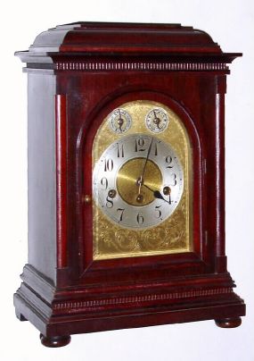German, Junghans, 8-day Westminster chime bracket clock. Mahogany case in nice clean condition in an original finish with a small ding on the back edge of the top molding. Original dial is exceptionally nice for a clock of this age. Brass movement chiming on rods is signed. C.1910. — Antique Clocks Price Guide