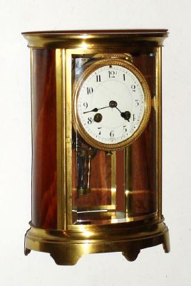 French, Japy Freres, 8-day time/strike crystal regulator mantel clock, small oval case, and with 2-vial compensating pendulum, now with wooden side and rear panels. Circa 1910. — Antique Clocks Price Guide