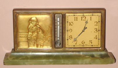Swiss, Partner's Desk clock (dial on each side), with a calendar on one side and a gilt bronze relief of a sailor in rain gear (she looks female to us), and a thermometer on both sides, the base of green onyx, jeweled movement stem wound from bottom. C.1930 — Antique Clocks Price Guide