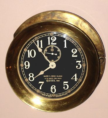 Seth Thomas, MARK I DECK CLOCK, U.S. Navy Bureau of Navigation, with rear, hinged wall mount intact, serial No. 2556, C.1940 (dated on dial) — Antique Clocks Price Guide