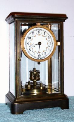 German "Anniversary" 400-day timepiece in a heavy 4- glass, crystal regulator case, serial No. 7677, by Kienzle, plate 1008 (round). Circa 1904 — Antique Clocks Price Guide