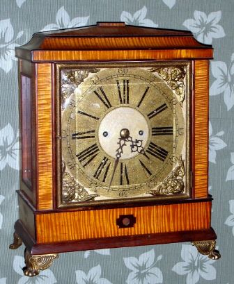 English, double fusee 8-day movement C.1850, now in a C.1975 home made case of tiger maple veneer over plywood. — Antique Clocks Price Guide