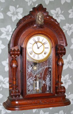 Waterbury Clock Co, Walnut Parlor clock with single barrel pendulum, note full round fluted columns and Diana bust in crest, 8-day spring, C.1880 — Antique Clocks Price Guide