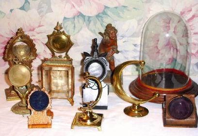 Ten (10) watch holders including gilt, gutta percha, wooden, one on marbleized base and a ten inch dome with base. — Antique Clocks Price Guide
