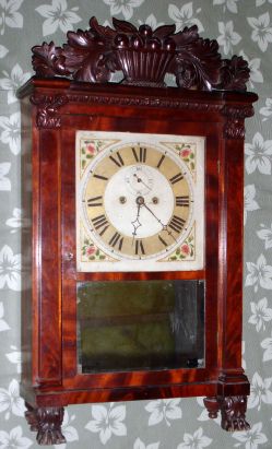 C.1830, Spencer, Hotchkiss and Co., Salem Bridge shelf clock, in a mahogany veneered case with pilasters, Corinthian capitals and a well carved fruit bowl splat and paw feet. — Antique Clocks Price Guide
