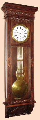 Waterbury Clock Co., "REGULATOR No. 7" walnut cased wall clock with glass on 3 sides, with pinwheel movement and center sweep seconds hand. — Antique Clocks Price Guide