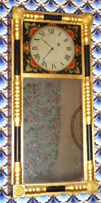 William Purinton, Lancaster, New Hampshire, 8-day wall timepiece, or "New Hampshire Mirror Clock" Circa 1820. William Purinton worked in Portland, Maine; Vassalborough, Maine and Lancaster, New Hampshire. A picture of the movement is shown in: "Willard's Patent Time Pieces by Paul Foley, pg. 96" and another example showing the movement and case of the same design is found in: "New Hampshire Clocks and Clockmakers" by Charles Parsons, pg. 204. — Antique Clocks Price Guide