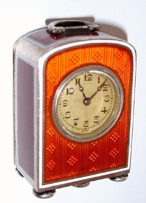 Swiss, miniature Sterling cased clock with caramel colored guilloche enamel, and a Swiss 15j stem wind movement from the base. Hallmarked and showing 'sterling' and 0.925 — Antique Clocks Price Guide