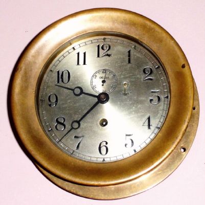 Chelsea Clock Co., 8-day "Marine", ward room or engine room timepiece, Serial No. 268610, yellow brass case with screw bezel, 6" dial, C.1940 — Antique Clocks Price Guide