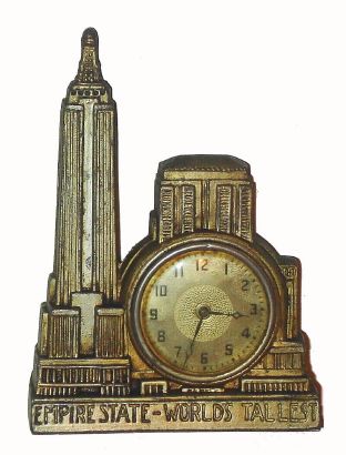 F. P. Dressler, NY (Novelty Co) , cast metal case of the Empire state building with a 30-hour lever movement timepiece. Bottom of the case is marked Dressler. Circa 1930 — Antique Clocks Price Guide