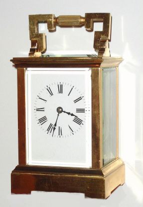 French, brass cased carriage clock, time and gong strike, in a square cornered "Anglaise" case, and with its original leather covered travel box. C.1900 — Antique Clocks Price Guide