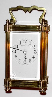 French, brass cased carriage timepiece, in a multi-piece case with nut type finials on top and feet on the base, retailed by Tiffany and Co (good signature on dial), c.1900 — Antique Clocks Price Guide