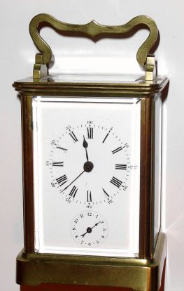 French, Brass cased carriage clock, time, strike and alarm, in a simple Corniche case, and with original lever platform intact. C.1900 — Antique Clocks Price Guide