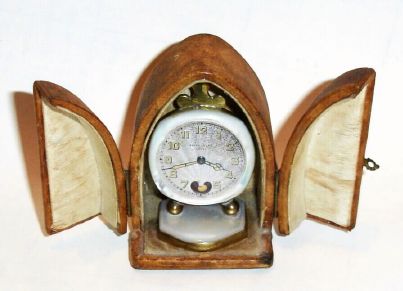 Swiss for French souvenir market, FLEUR DE LYS, mini heartbeat "watch" clock with beating heart visible in lieu of numberal 6, and with original travel case/gift box. C.1900 — Antique Clocks Price Guide