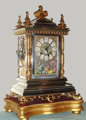 French, Japy Freres, for the Asian market, a nice architectural clock with Japanese front panel showing 2 Geisha girls in full costume, and on a gilt wooden base, 8-day time and gong strike, C.1895 — Antique Clocks Price Guide