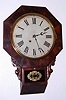 New Haven Clock Co, short drop octagon, chisel bottom wall clock, 8-day time, mahogany veneer case. C.1880.