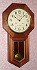 Seth Thomas Clock Co., WORLD model, walnut long drop octagon timepiece, 15-day. C. 1921.