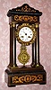 French, Vincenti and Cie, Empire style mantle clock with inlaid case and cast pendulum and bezel, 8-day bell strike. C. 1880.