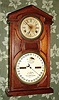 Ithaca Calendar Clock Co., "No. 7 SHELF COTTAGE", 30-day, time, double spring, walnut case, double dial perpetual calendar. C. 1874.