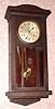 Waterbury Clock Co. "HANGING CHIME No. 236", dark mahogany cased Westminster Chime wall clock on rods, 8-day, spring. C.1923.