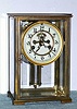 Waterbury Clock Co., MANCHE, 4-Glass, crystal regulator, 8-day striking, and with uncommon Waterbury single jar faux compensating pendulum. We have had several with the pendulum over the years. C.1910.