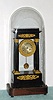French, Empire-style black ebonized four column case with gilt ormolu surrounds and trim, spring driven brass mvt, excellent dome measures 24 1/2"H x 11"L x 7"W, clock measures 18"H. C. 1860.