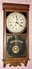 E. Ingraham and Co, Bristol Conn, "WESTERN UNION" calendar model, 8 day time brass mvt store regulator in solid oak case with 12" dial, spring driven. C. 1907.