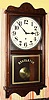 New Haven, New Haven Conn, "REFEREE" model, 8 day time only brass mvt in poplar case with walnut stain and 12" paper over zinc dial, spring driven. C. 1925.