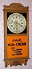 Gilbert Clock Co, Winsted Conn, "OBSERVATORY" calendar model, 8 day time brass mvt in oak case with reproduction "drink Ward's Orange CRUSH also Lemon-CRUSH Lime-CRUSH" orange and black painted tablet , spring driven. C. 1913.