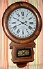 Ansonia Brass and Copper Co, Ansonia, Conn. "DROP EXTRA CALENDAR" model, 8 day time brass mvt in rosewood veneered case with 12" dial with aperture for month and indicator hand for date marked "TERRY'S PATENT. MANUFACTURED BY THE ANSONIA BRASS and CPPER CO. ANSONIA. CONN.", spring driven. C. 1883.