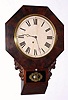Daniel Pratt, Jr, Reading Mass, short drop octagonal model, 8 day time brass mvt in mahogany veneer case with 12" dial, spring driven. C. 1855..