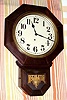 E. Ingraham and Co, Bristol Conn, "BRISTOL" short drop octagonal model, 8 day brass mvt in mahogany finish case with gilded French brass sash, 12" dial, spring driven. C. 1930.