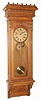 Wm. L. Gilbert Clock Co., Winsted, Conn, "REGULATOR No. 11", in an oak case with burled accent. C.1891.