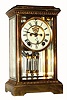 Ansonia Clock Co, WANDA model 4-glass crystal regulator, with 8-day time and rack-strike movement with open escapement on the dial. C.1914.