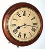 English, W. Elliott, Dial or pub clock, single fusee, time only in a mahogany case, serial No. 17868. C.1900.