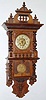 German, Kienzle, open well Berlin style free swinger, in a walnut case, gong strike 8-day, spring. C.1900.