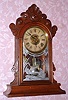 Wm. L. Gilbert Clock Co., "PAROLE", walnut cased parlor clock, time and gong strike, 8-day, spring. C.1885.