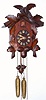 American Cuckoo Clock Co., Philadelphia, 1-day time and strike wall clock, 7 leaf and single bird pattern, the movements imported from Germany, cases made in PA. C.1910.