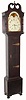 American tall clock, unsigned, 8-day with rolling moon, the last repair label from 1883, Philadelphia. movement with well shaped plates along the top and cut out at bottom to conserve brass. The informal country case of mixed woods retains large cast door hinges and a deep broken arch. C.1825.